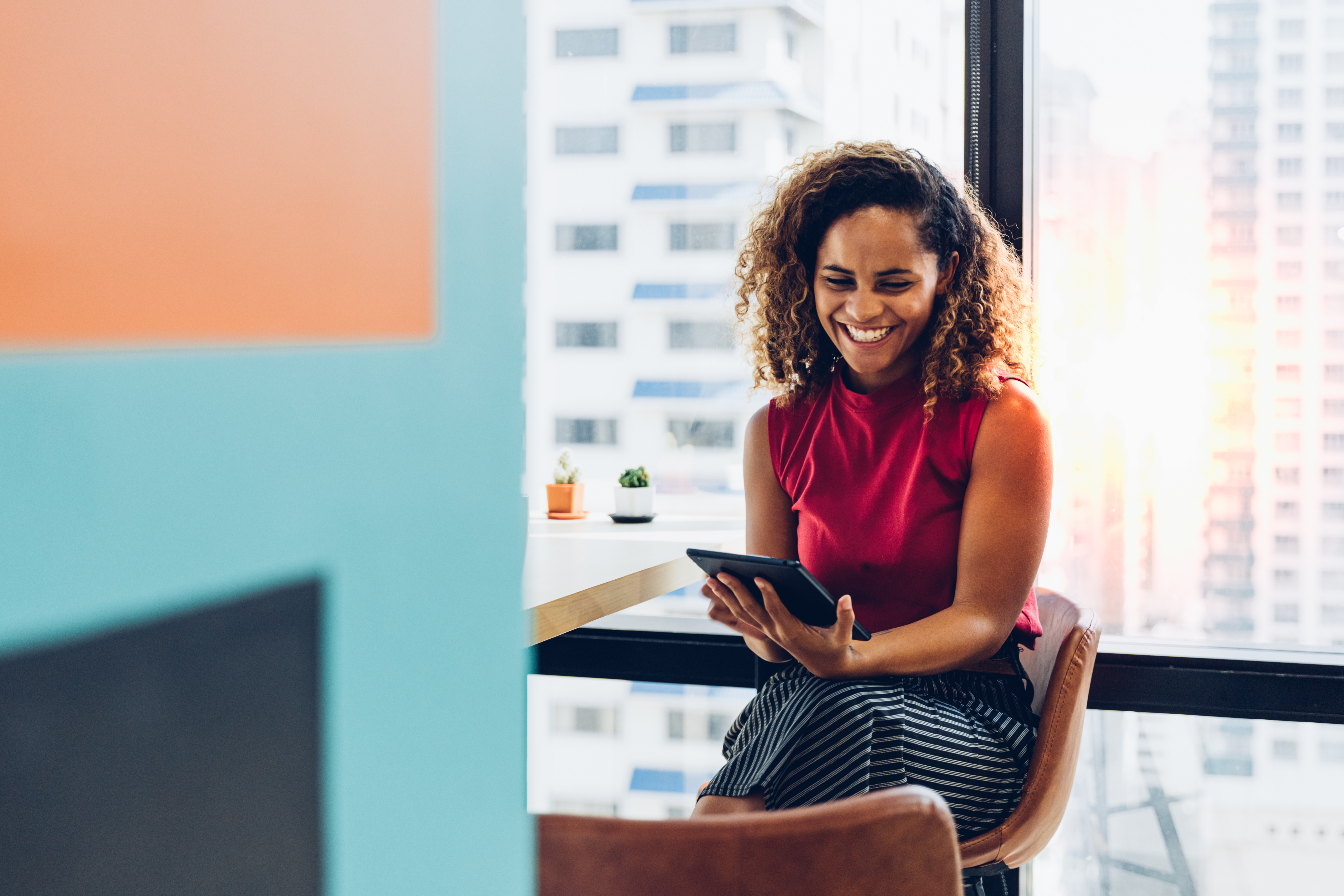 Woman smiling at laptop